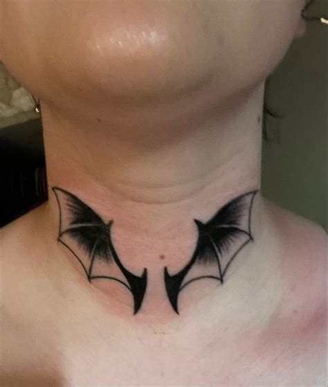 bat tattoo on neck